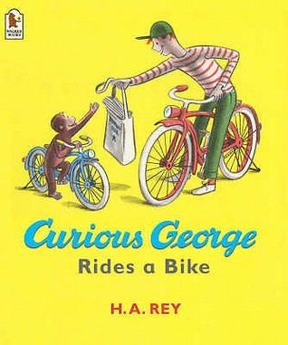 Curioso George monta una bicicleta